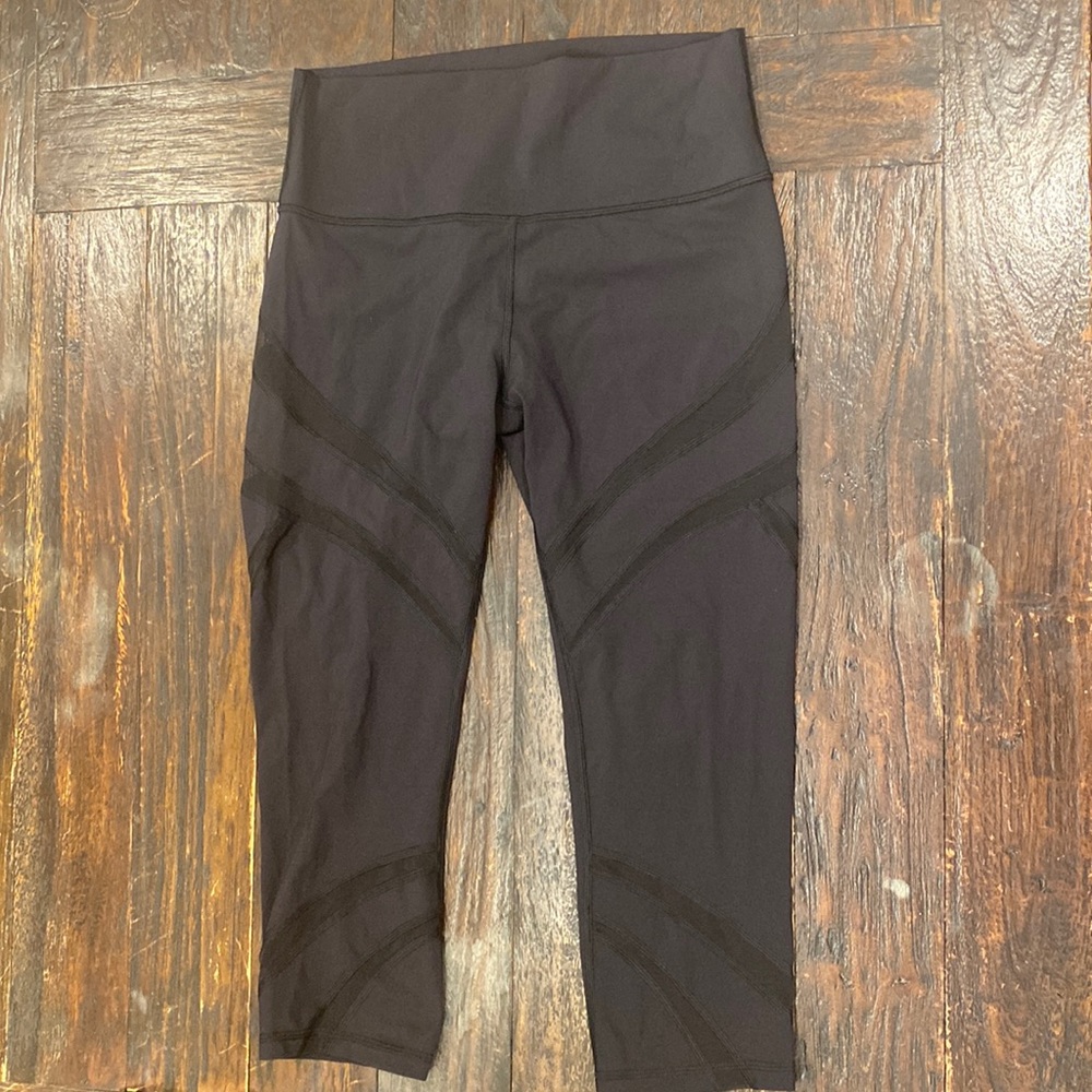 Lululemon Black High Rise Yoga Pant with Mesh Cutouts in a size 8